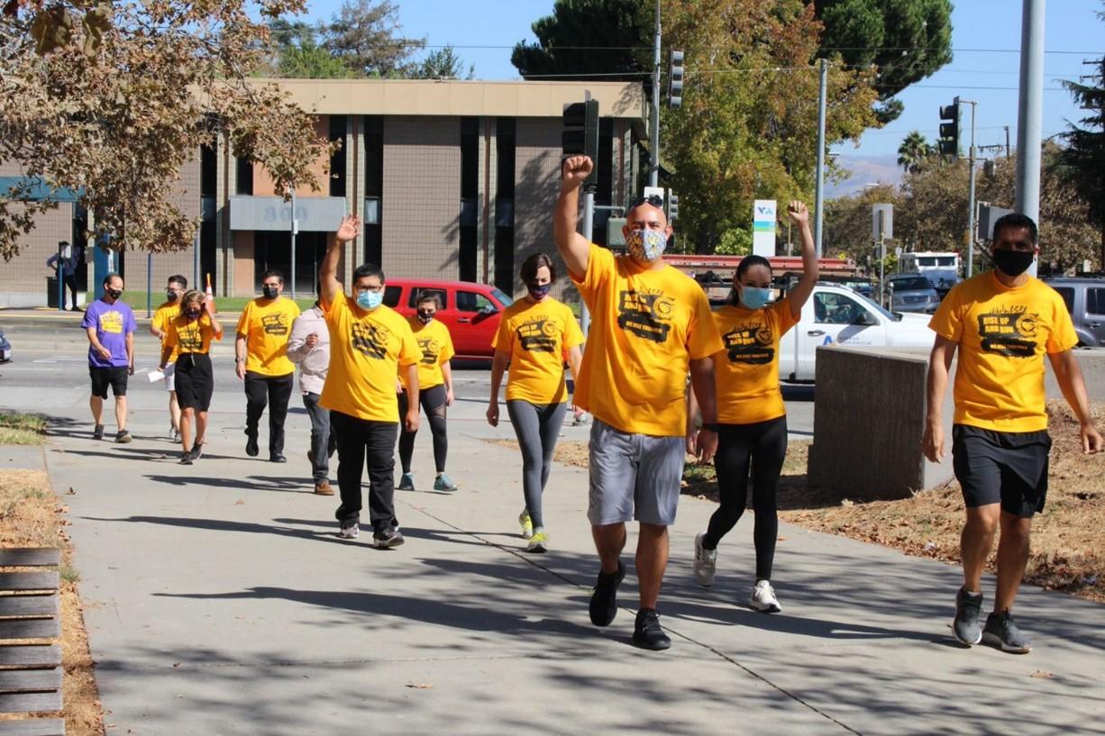 2012 Rise Up and Run Participants Jog Around in Their Yellow Tshirts
