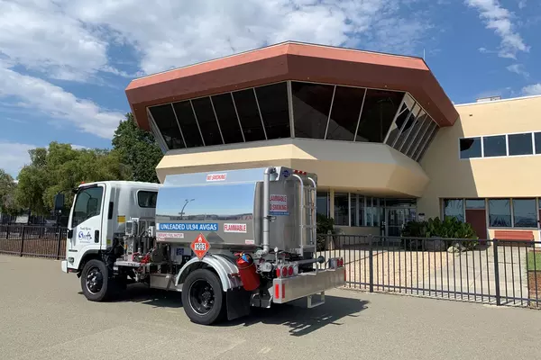 A fueling truck containing unleaded aviation fuel is parked near the control tower at Reid-Hillview Airport in San Jose.