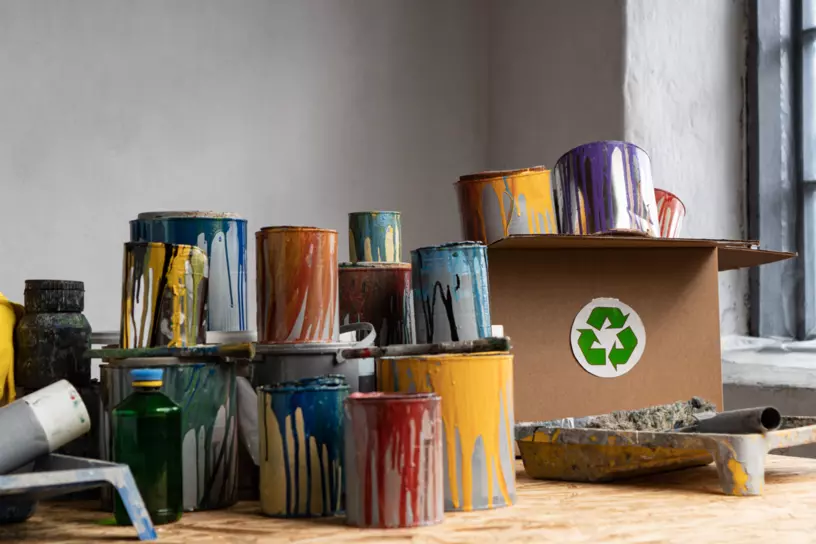 colorful dripping paint cans on the floor