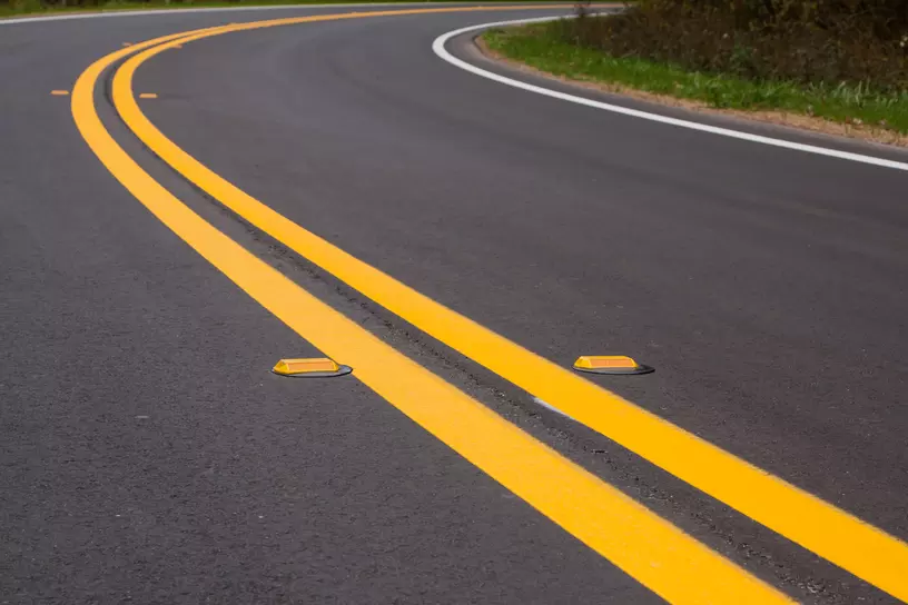 Roadway divider lines and markers