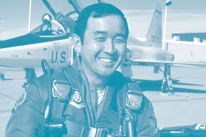 ellison onizuka - in flight jacket standing in front of usaf jet - aapi month graphic 