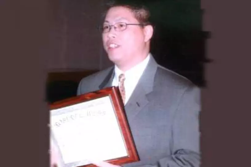 Christopher Kwok receiving the Robert L. Webb Award