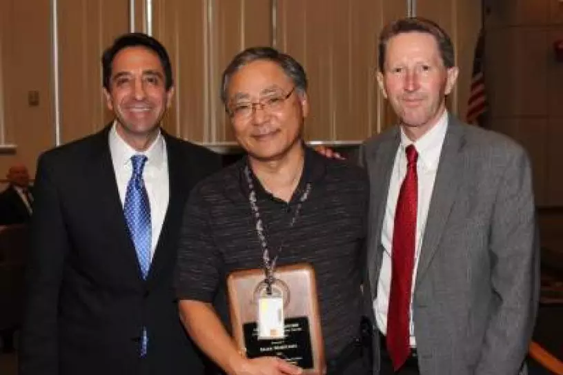 Mark Moriyama receiving the Lowell W. Bradford Achievement of Excellence Award for Crime Lab Division