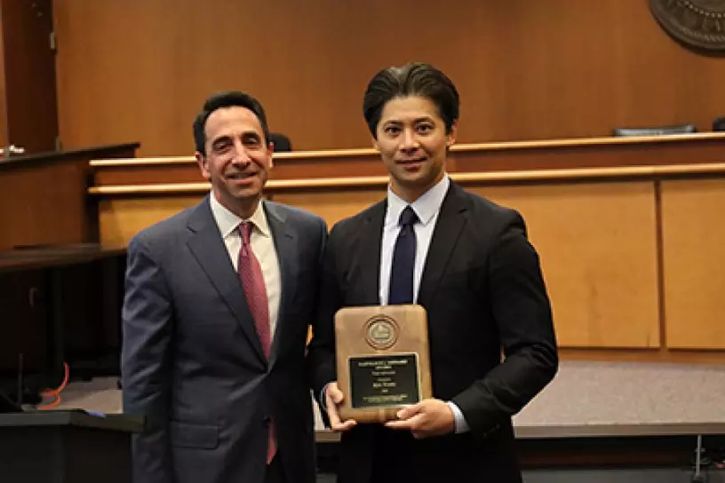 Kin Tong receiving the Napoleon J. Menard Award for Felony Trial Advocacy
