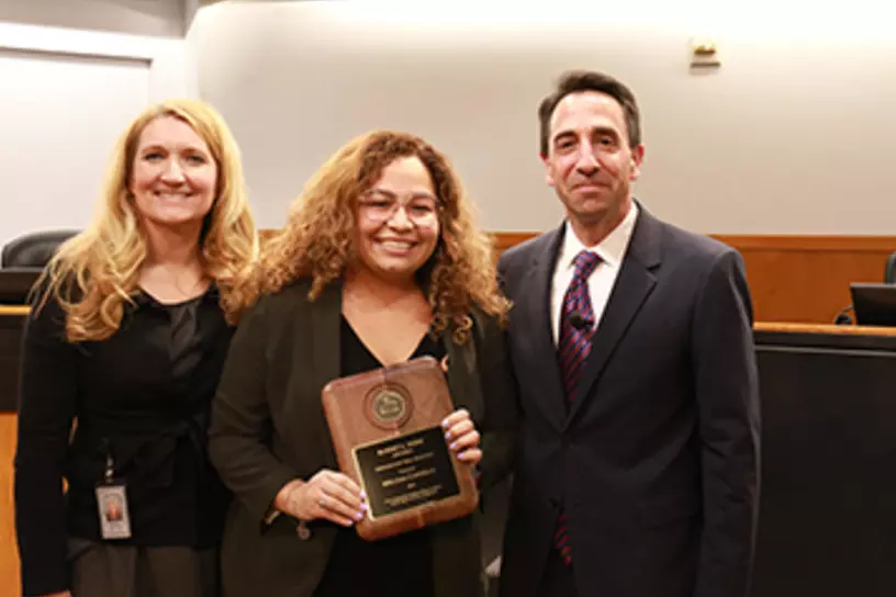 Melissa Castillo receiving the Robert L. Webb Award