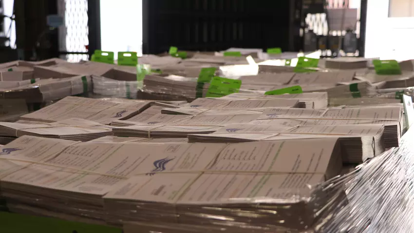 A stack of County Voter Information Guides ready to be mailed out