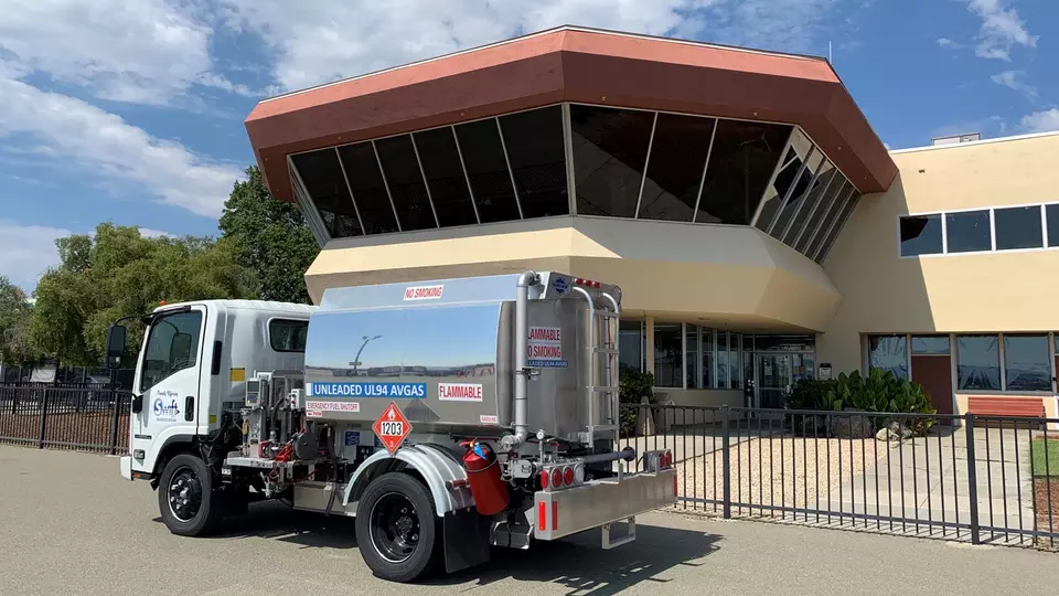 A fueling truck containing unleaded aviation fuel is parked near the control tower at Reid-Hillview Airport in San Jose.