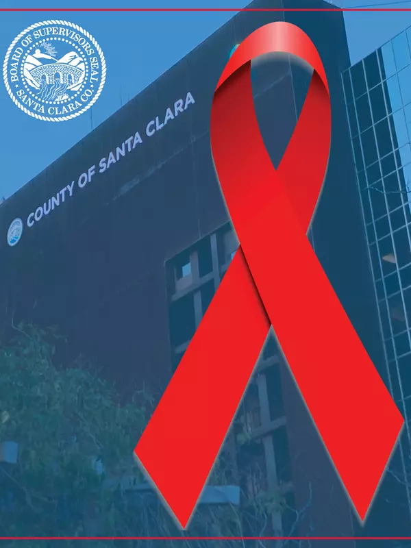red ribbon logo with building in background