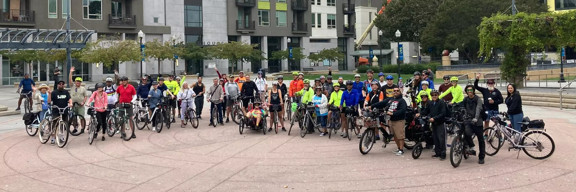 large group of people with bikes