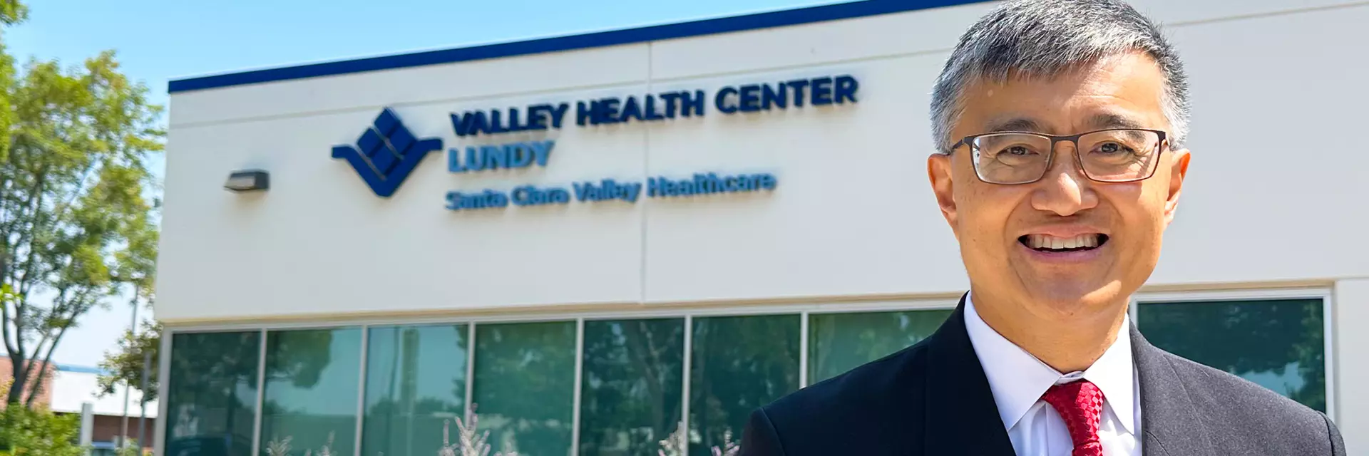 Supervisor Otto Lee stands in front of VHC Lundy Clinic