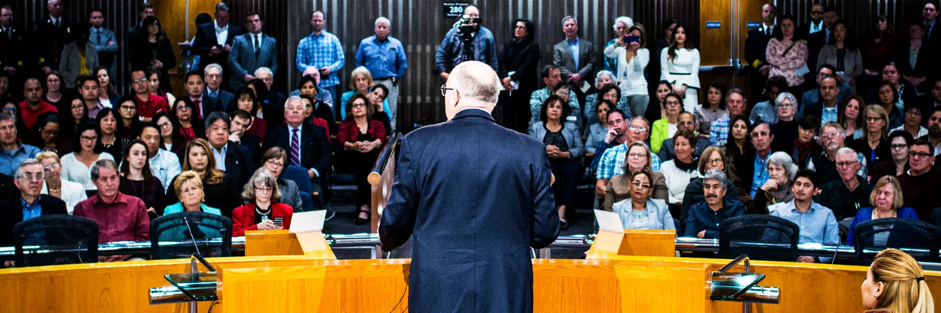 Joe speaking before the public during a Board of Supervisors meeting.