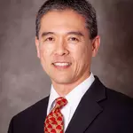 headshot of robert nakamae with black suit and red tie