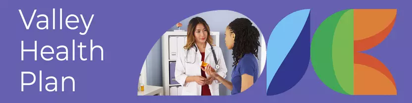 female asian doctor explaining prescription to black female patient in doctors office
