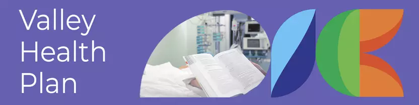 hospital room hands holding a provider manual